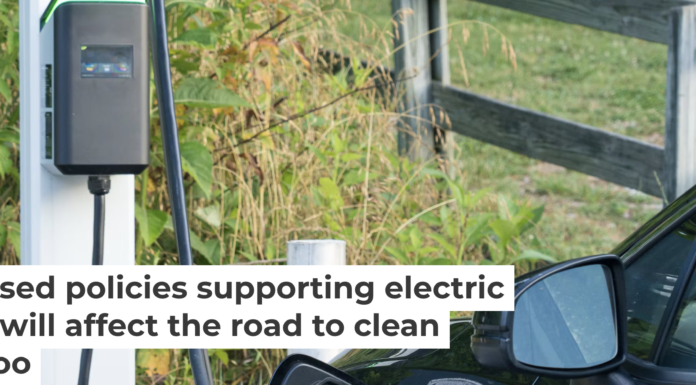 An electric vehicle is plugged in at a charging station. Marcia Stroub/Moment via Getty Images